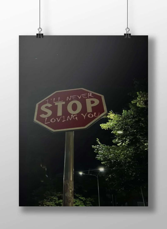 Stop sign modified with "I'LL NEVER STOP LOVING YOU" graffiti Main Subject: Stop sign modified with "I'LL NEVER STOP LOVING