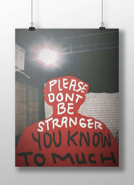 The phrase "PLEASE DON'T BE STRANGER YOU KNOW TO MUCH" displayed in a red silhouette. Main Subject: The phrase "PLEASE DON'T