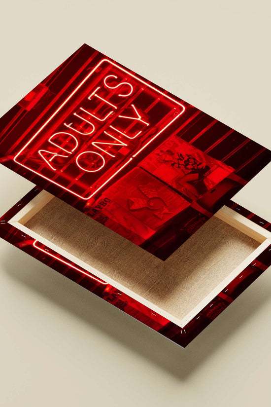 Red neon sign reading "ADULTS ONLY" mounted above PlayboY magazine covers Red Neon Adults Only