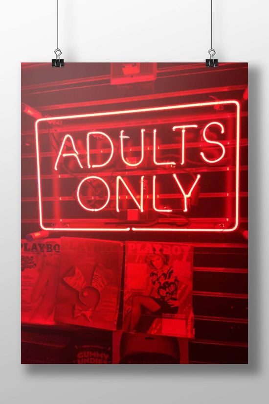 Red neon sign reading "ADULTS ONLY" mounted above PlayboY magazine covers Red Neon Adults Only