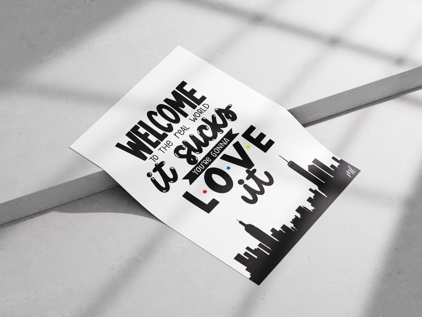 The motivational text phrase "WELCOME TO THE REAL WORLD it sucks YOU'RE GONNA LOVE it" Main Subject: The motivational text