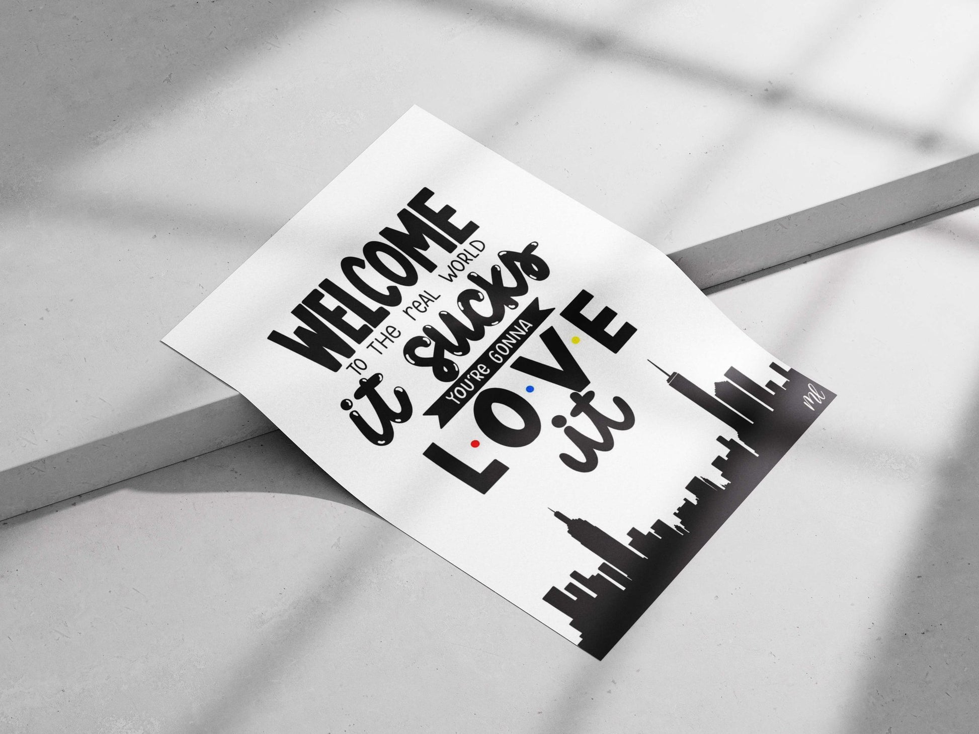 The motivational text phrase "WELCOME TO THE REAL WORLD it sucks YOU'RE GONNA LOVE it" Main Subject: The motivational text