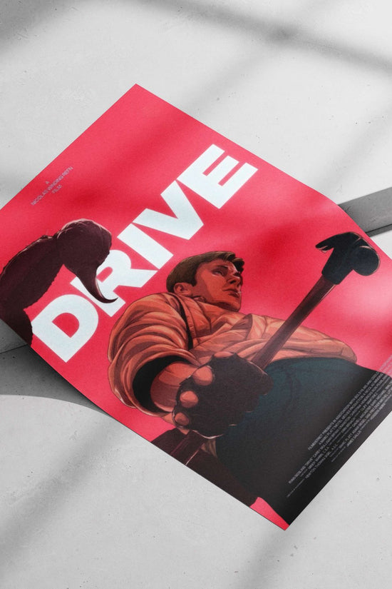 The film "Drive" (2011) directed by Nicolas Winding Refn, featuring Ryan Gosling as the protagonist. Main Subject: The film