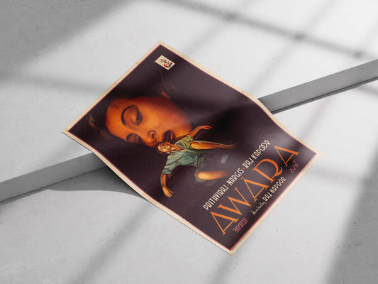 Product packaging with a stylized face and text on a gray surface.  Surrealist Awaara movie poster with a giant portrait of Nargis and Raj Kapoor, styled on a dark accent wall in a modern living room.
