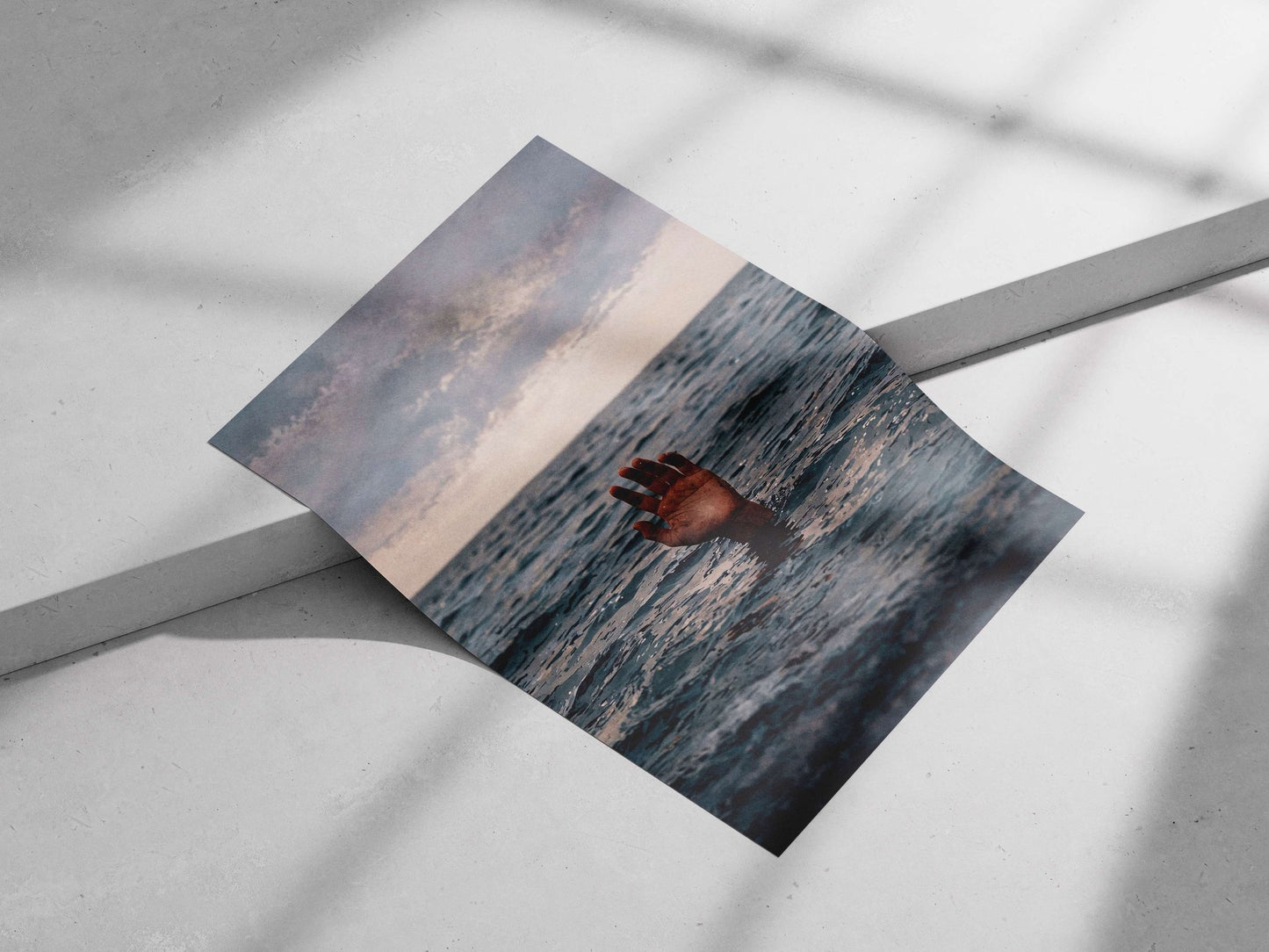 Human hand emerging from ocean water Main Subject: Human hand emerging from ocean water Matte poster print — Art wall art