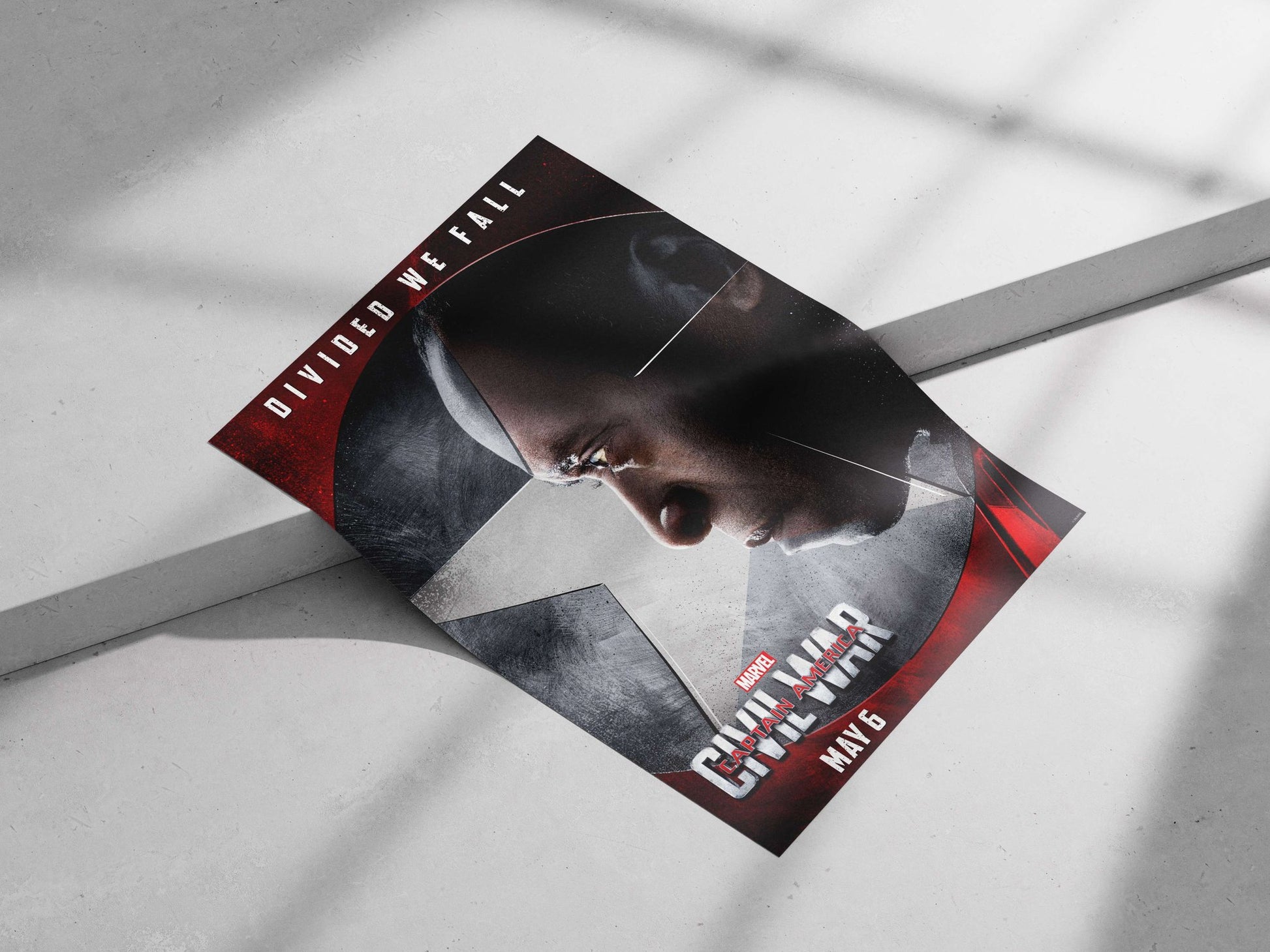 Captain America: Civil War (Marvel film, confirmed by "DIVIDED WE FALL" tagline and "CAPTAIN AMERICA"
