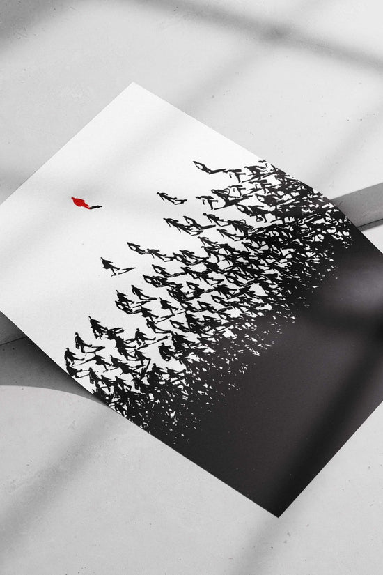 A lone red silhouette standing above a crowd of black walking silhouettes Main Subject: A lone red silhouette standing above