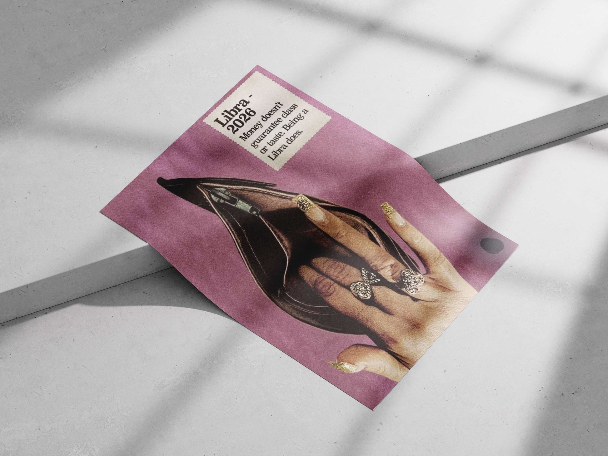 A human hand with gold glitter nail polish and bow-shaped rings positioned inside an open black stiletto heel, accompanied
