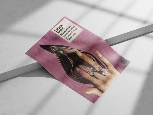 A human hand with gold glitter nail polish and bow-shaped rings positioned inside an open black stiletto heel, accompanied