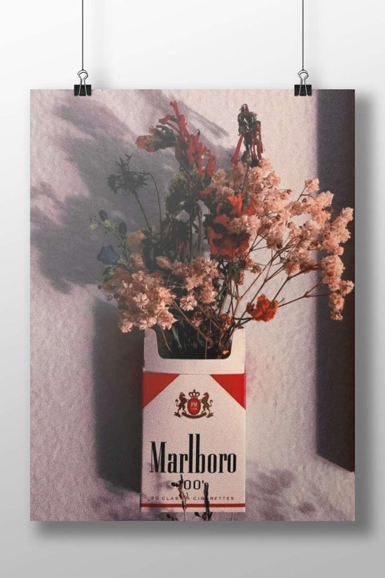Marlboro cigarette pack (repurposed as a floral vase) Main Subject: Marlboro cigarette pack (repurposed as a floral vase)