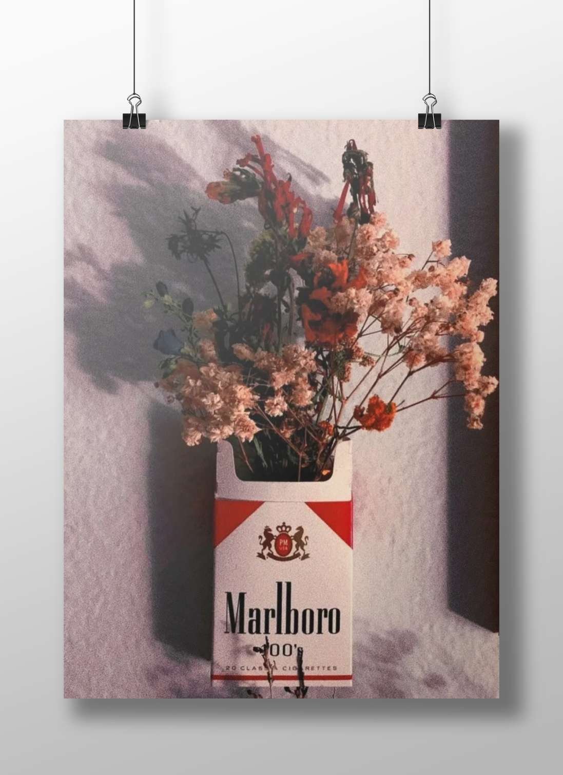 Marlboro cigarette pack (repurposed as a floral vase) Main Subject: Marlboro cigarette pack (repurposed as a floral vase)