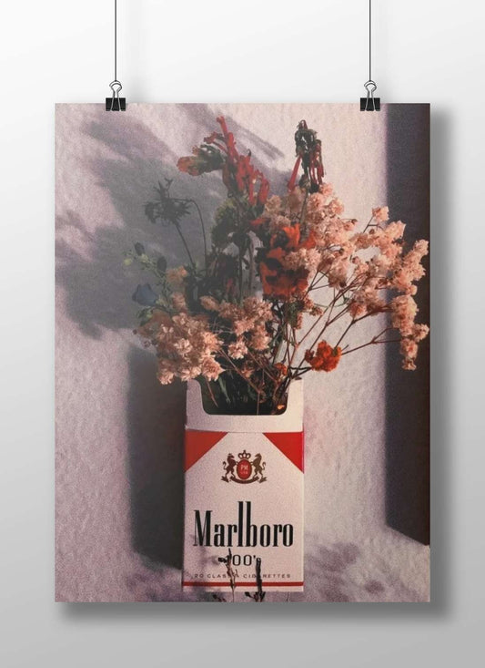 Marlboro cigarette pack (repurposed as a floral vase) Main Subject: Marlboro cigarette pack (repurposed as a floral vase)