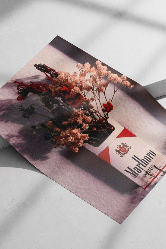 Marlboro cigarette pack (repurposed as a floral vase) Main Subject: Marlboro cigarette pack (repurposed as a floral vase)