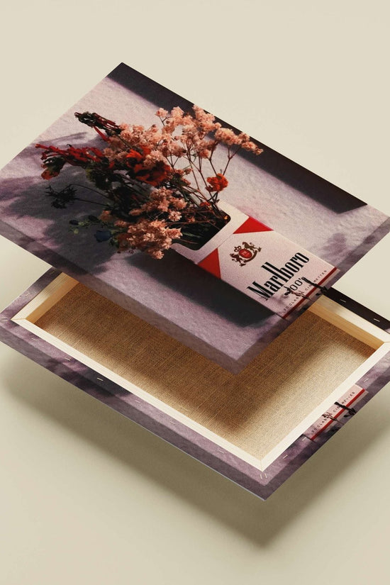 Marlboro cigarette pack (repurposed as a floral vase) Main Subject: Marlboro cigarette pack (repurposed as a floral vase)