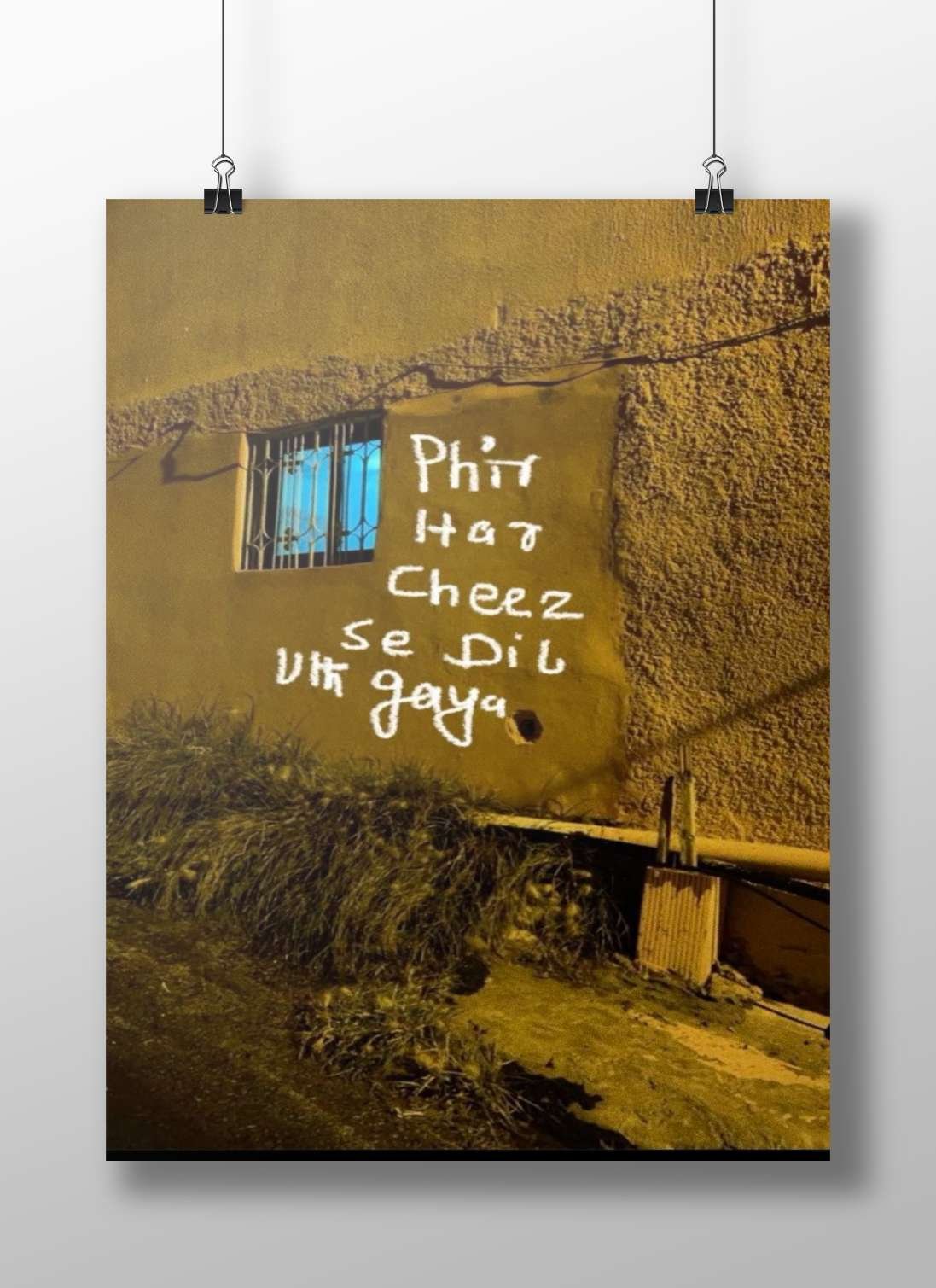 The Hindi graffiti text "Phir Hat Cheez se Dil Vhi gaya" written on the wall. Main Subject: The Hindi graffiti text "Phir
