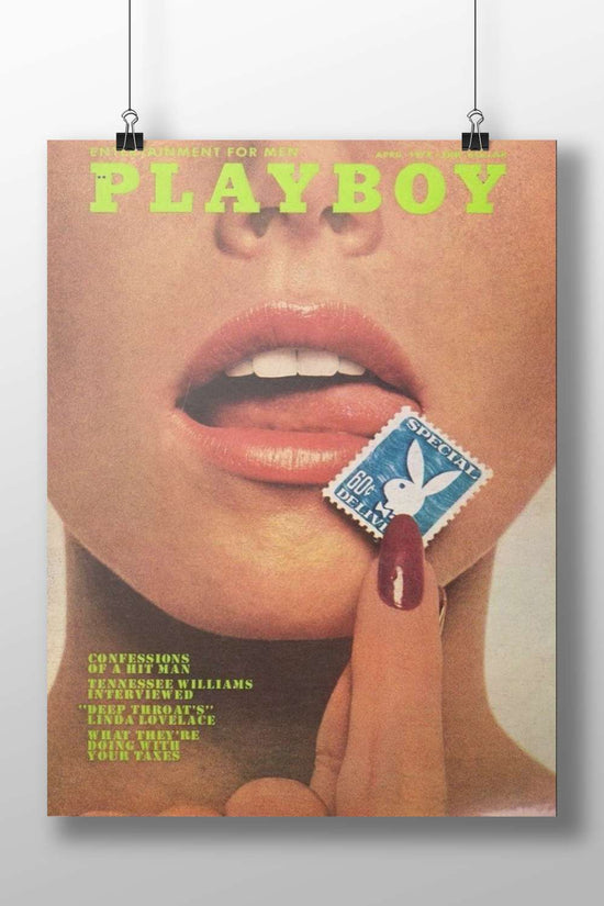 Close-up of a person's face with a hand holding a Playboy-branded stamp near the lips,