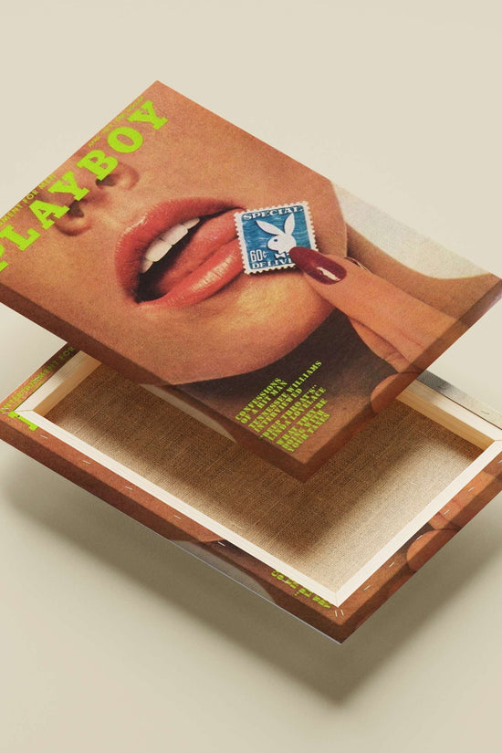 Close-up of a person's face with a hand holding a Playboy-branded stamp near the lips,