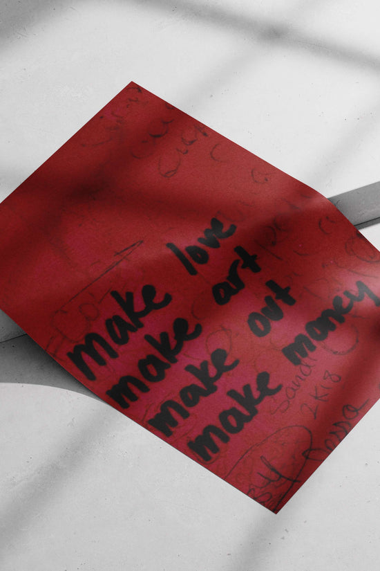 hand-painted motivational graffiti wall art with phrases "make love, make art, make out, make money"