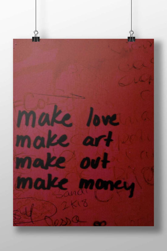 hand-painted motivational graffiti wall art with phrases "make love, make art, make out, make money"