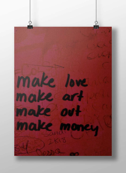 hand-painted motivational graffiti wall art with phrases "make love, make art, make out, make money"