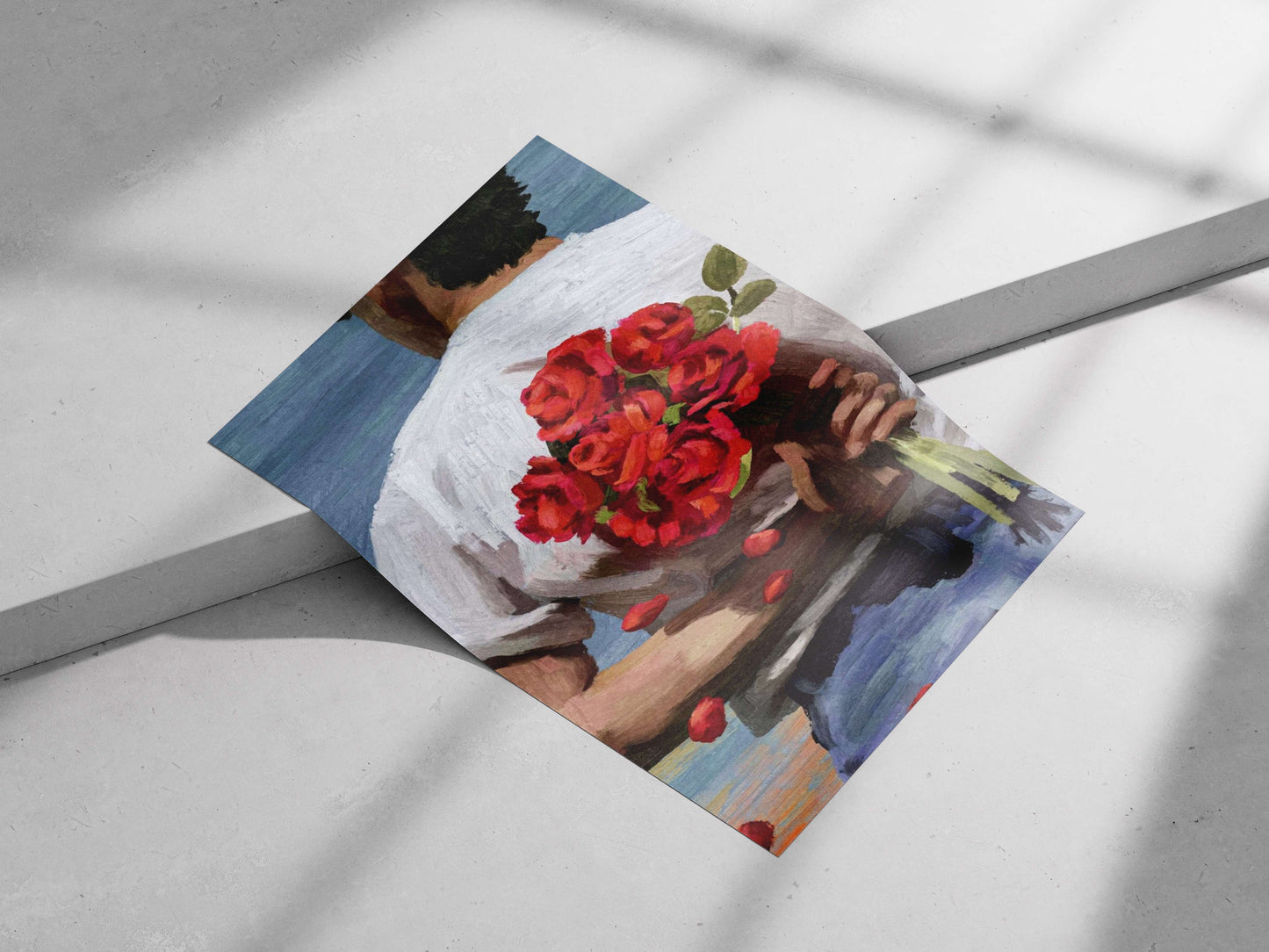 a man from the back holding a bouquet of red roses, wearing a white shirt
