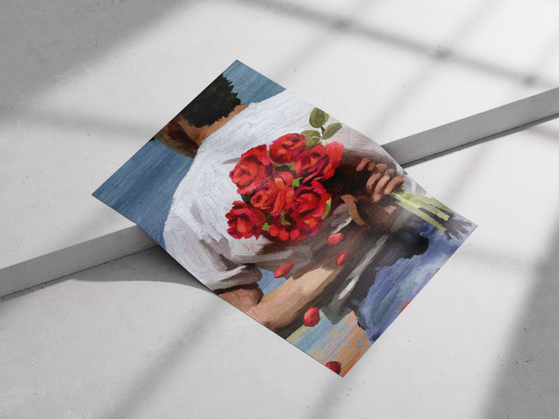 a man from the back holding a bouquet of red roses, wearing a white shirt