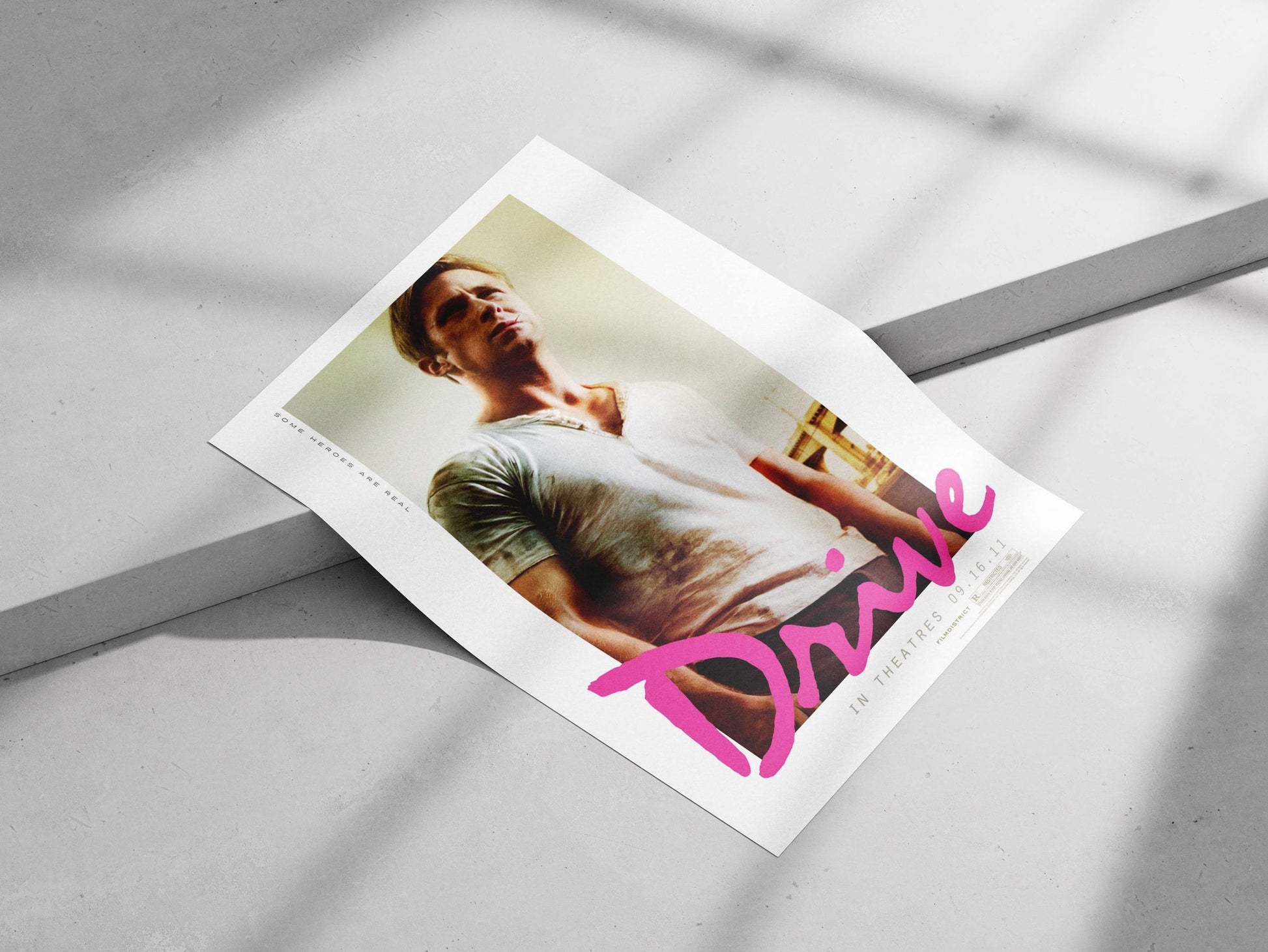 Drive (the film by Nicolas Winding Refn, confirmed by "FILMDISTRICT [R" as distributor/rating text) Nick