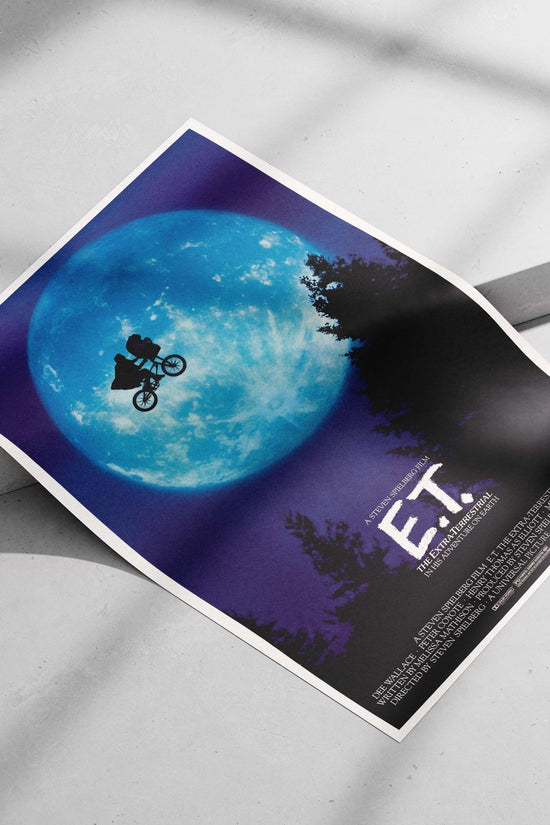 E.T. the Extra-Terrestrial (film franchise, featuring Elliott (Henry Thomas) and E.T. on a bicycle) Elliott
