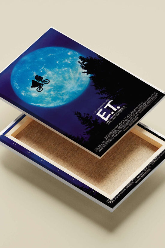 E.T. the Extra-Terrestrial (film franchise, featuring Elliott (Henry Thomas) and E.T. on a bicycle) Elliott