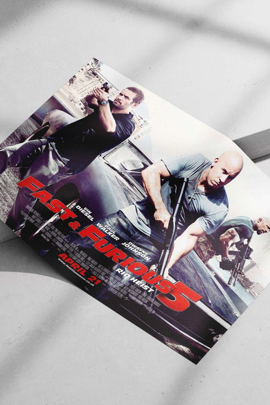 Fast & Furious 5 (movie franchise) featuring Vin Diesel, Paul Walker, and Dwayne Johnson. Dominic