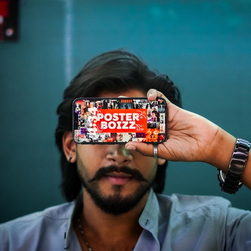 Person holding a smartphone with 'Posterbozz' app displayed in front of their face against a blurred background.