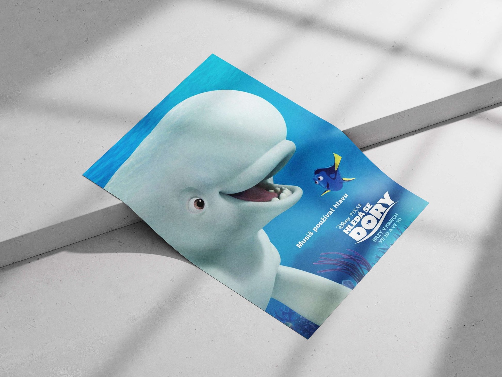 Dory (blue tang fish) and a beluga whale character from Disney•Pixar's Finding Dory Main Subject: Dory (blue tang fish) and