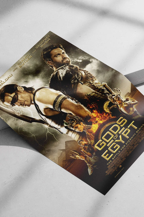 The movie poster for "Gods of Egypt" featuring actors Nikolaj Coster-Waldau, Gerard Butler, and Geoffrey Rush. Main Subject: