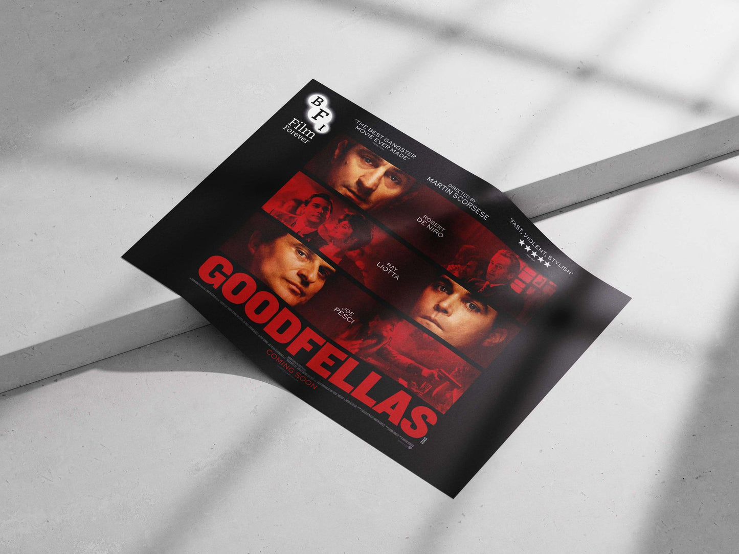 The film "Goodfellas" featuring actors Joe Pesci, Ray Liotta, and Robert De Niro. Main Subject: The film "Goodfellas"