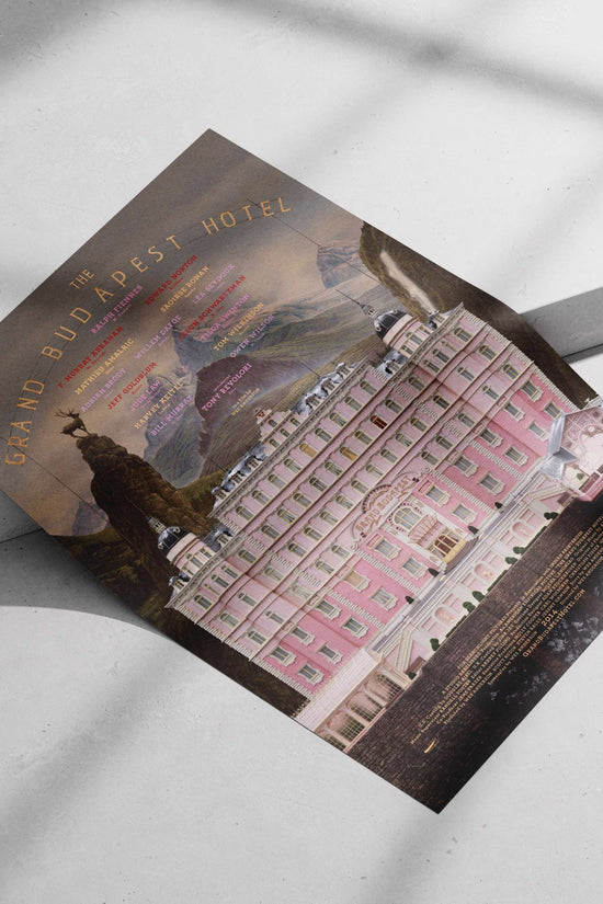 The film "The Grand Budapest Hotel" (Wes Anderson's 2014 movie) with cast names listed (e.g., Ralph Fiennes, Edward Norton).