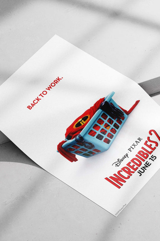 Incredibles 2 superhero costume (Mr. Incredible’s red suit with the "I" logo) in a laundry basket Main Subject: Incredibles