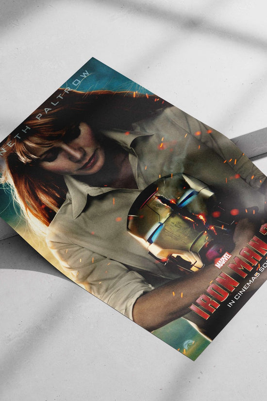 Gwyneth Paltrow as Pepper Potts holding an Iron Man helmet (Marvel's Iron Man franchise) Main Subject: Gwyneth Paltrow as