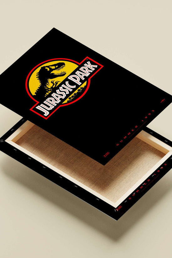 The Jurassic Park franchise logo, featuring a Tyrannosaurus Rex silhouette. Main Subject: The Jurassic Park franchise logo,