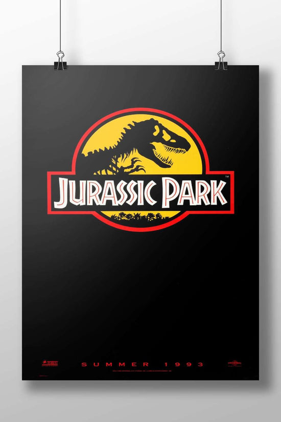 The Jurassic Park franchise logo, featuring a Tyrannosaurus Rex silhouette. Main Subject: The Jurassic Park franchise logo,