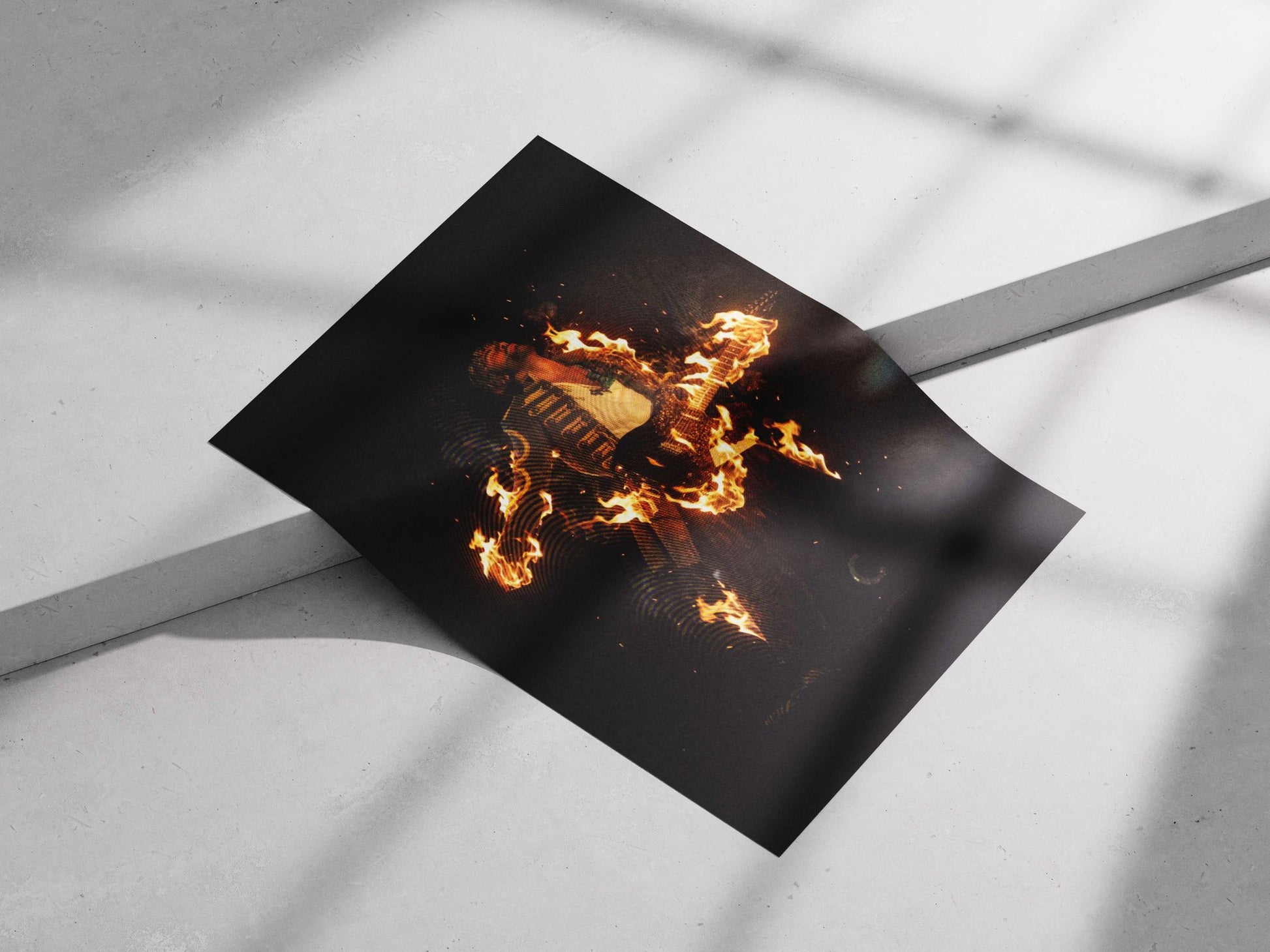 Guitarist holding electric guitar engulfed in flames Main Subject: Guitarist holding electric guitar engulfed in flames