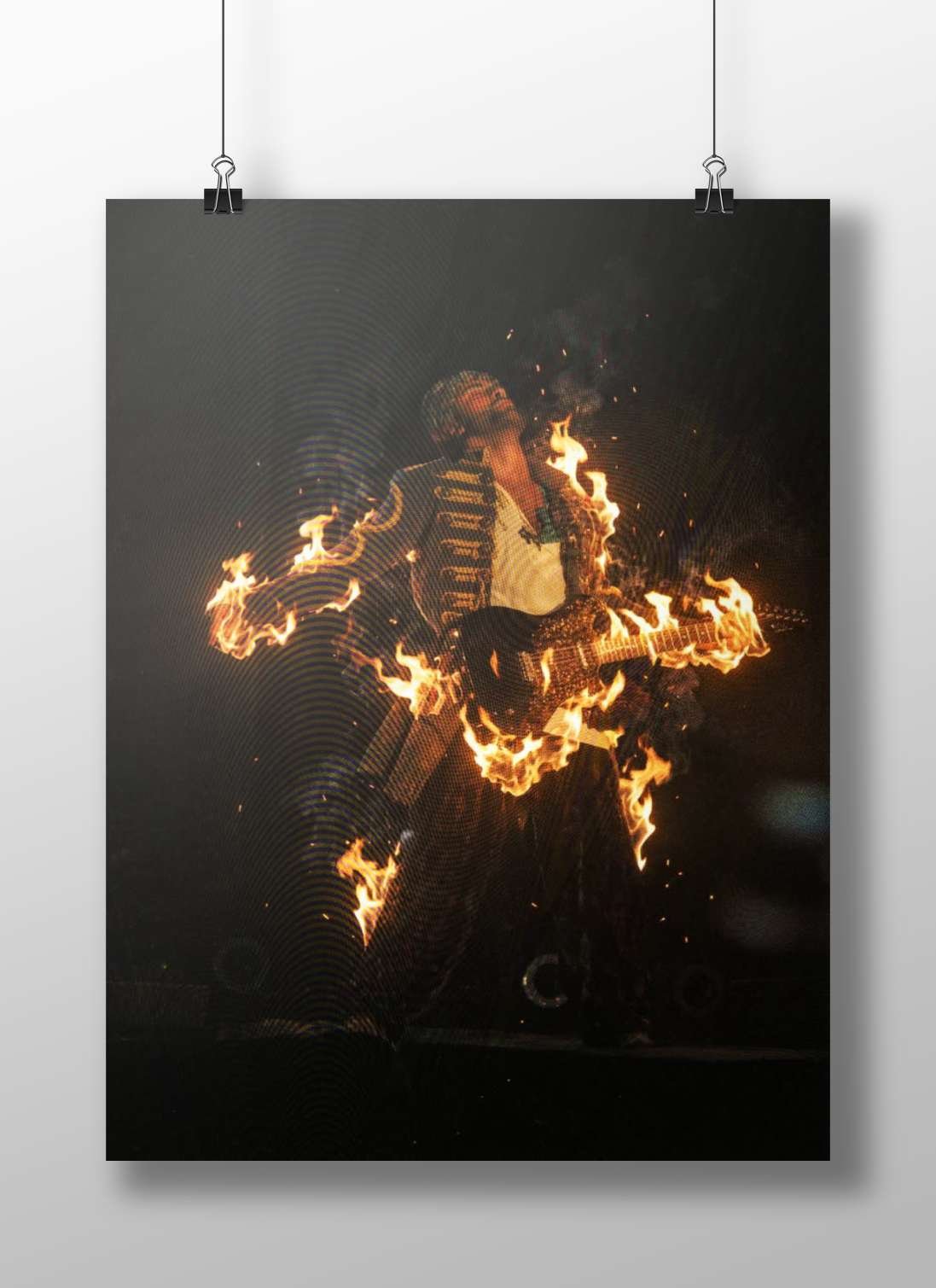 Guitarist holding electric guitar engulfed in flames Main Subject: Guitarist holding electric guitar engulfed in flames