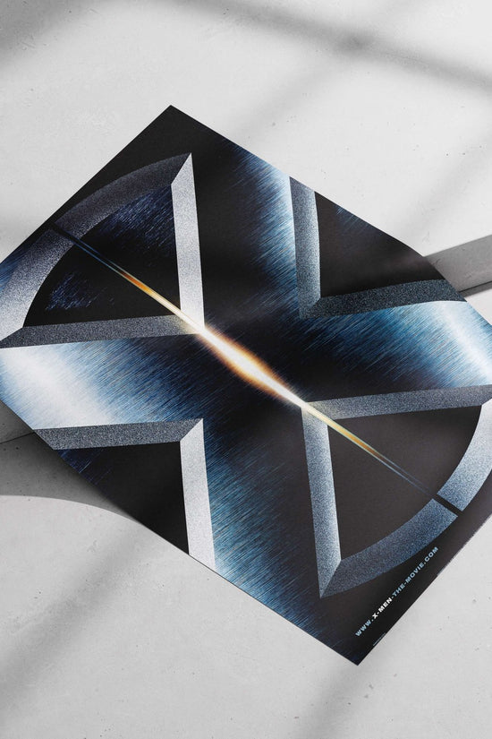 X-Men (the franchise, specifically the 2000 movie as per "X-MEN-THE-MOVIE.COM" text) Charles Xavier - Professor